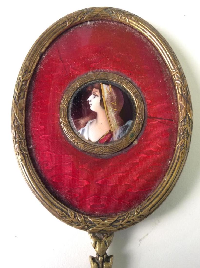 Guilloche Enamel And Bronze Hand Mirror, France: Vintage Guilloche Enamel And Bronze Hand Mirror, Marked Made in France, Formed as a bronze framed hand painted portrait, further framed in pigeon blood red guilloche enamel, reverse side beveled glass