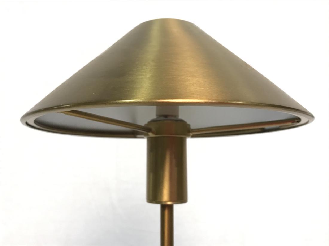 Gold Toned Stainless Steel Table Lamp: Lamp is stainless steel and gold toned. Table lamp, gold toned lamp, shelf lamp, metal lamp, stainless steel lamp. Measures approx 18.5 inches tall 5 inches wide. Table lamp, home accessory, home ligh