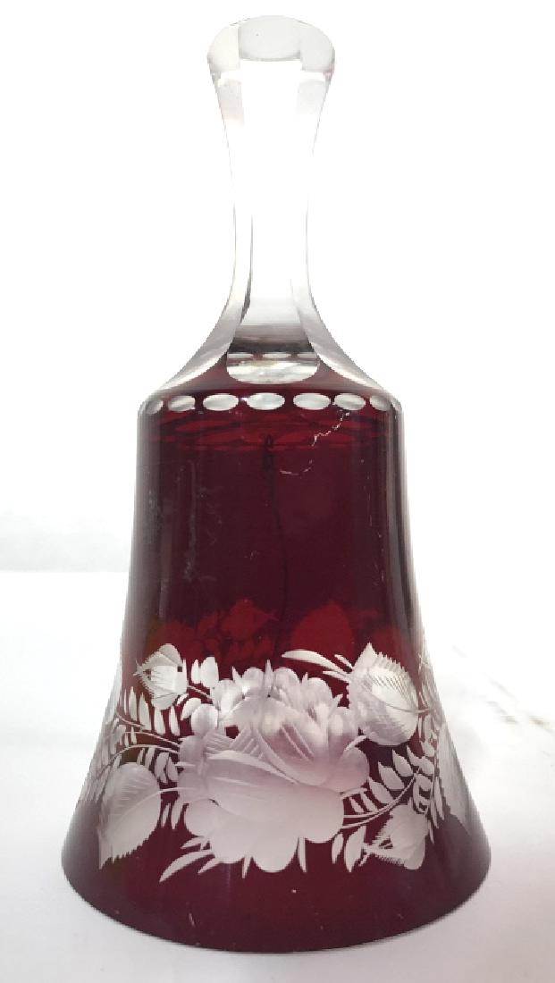 Cranberry Glass Art Glass Bell: Bell is cranberry toned. Contains intricate floral and leaf frosted detail. Art Glass Bell, cranberry Glass, red glass bell, bohemian glass bell. Measures approx 5.5 inches tall 3 inches wide. Decorat
