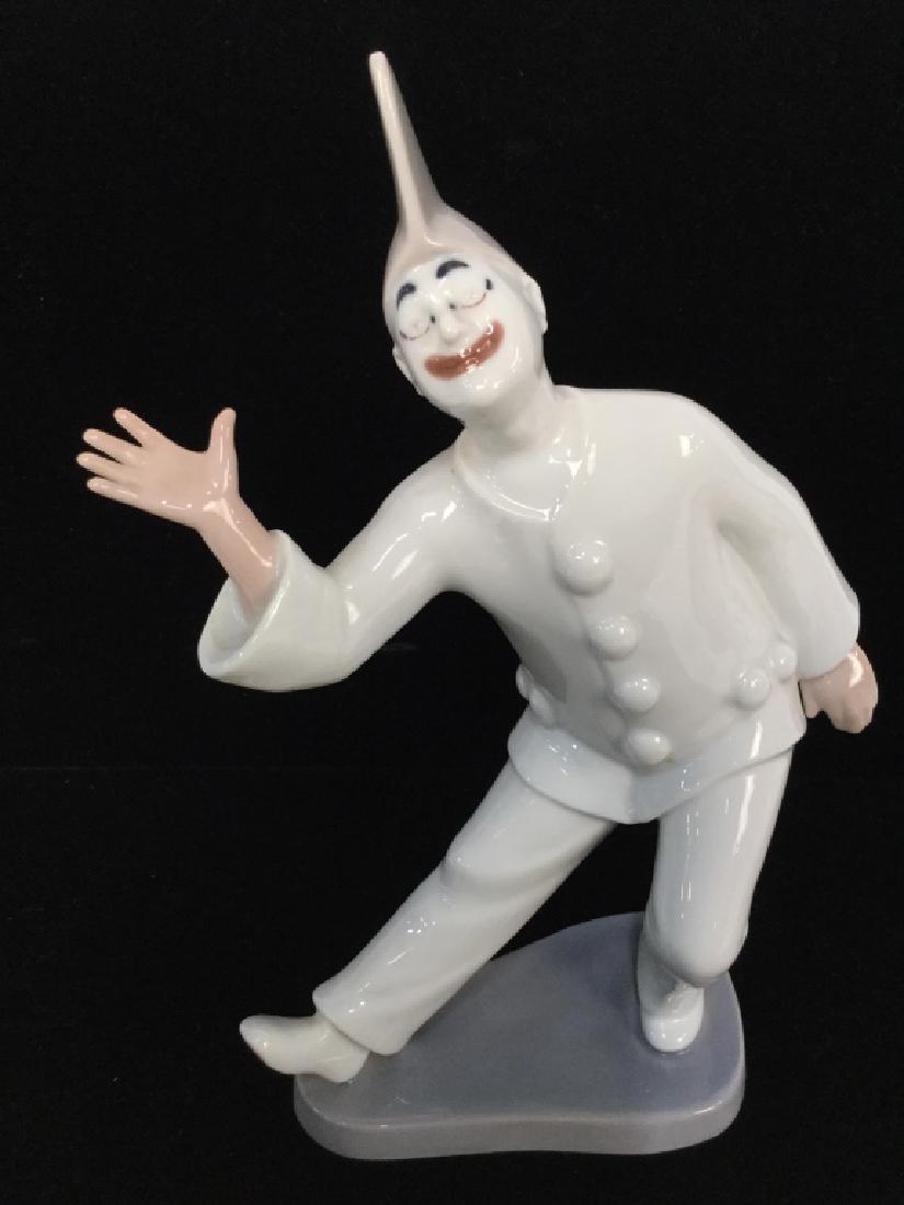 Bing and Grondahl Denmark Clown Statuette: Bing and Grondahl Denmark Clown Statuette Piece is marked B&G KJOBENHVN DENMARK on underside. Depicts a male figure dressed in clown style clothing Measures approx 9 inches tall 5 inches wide. No cond