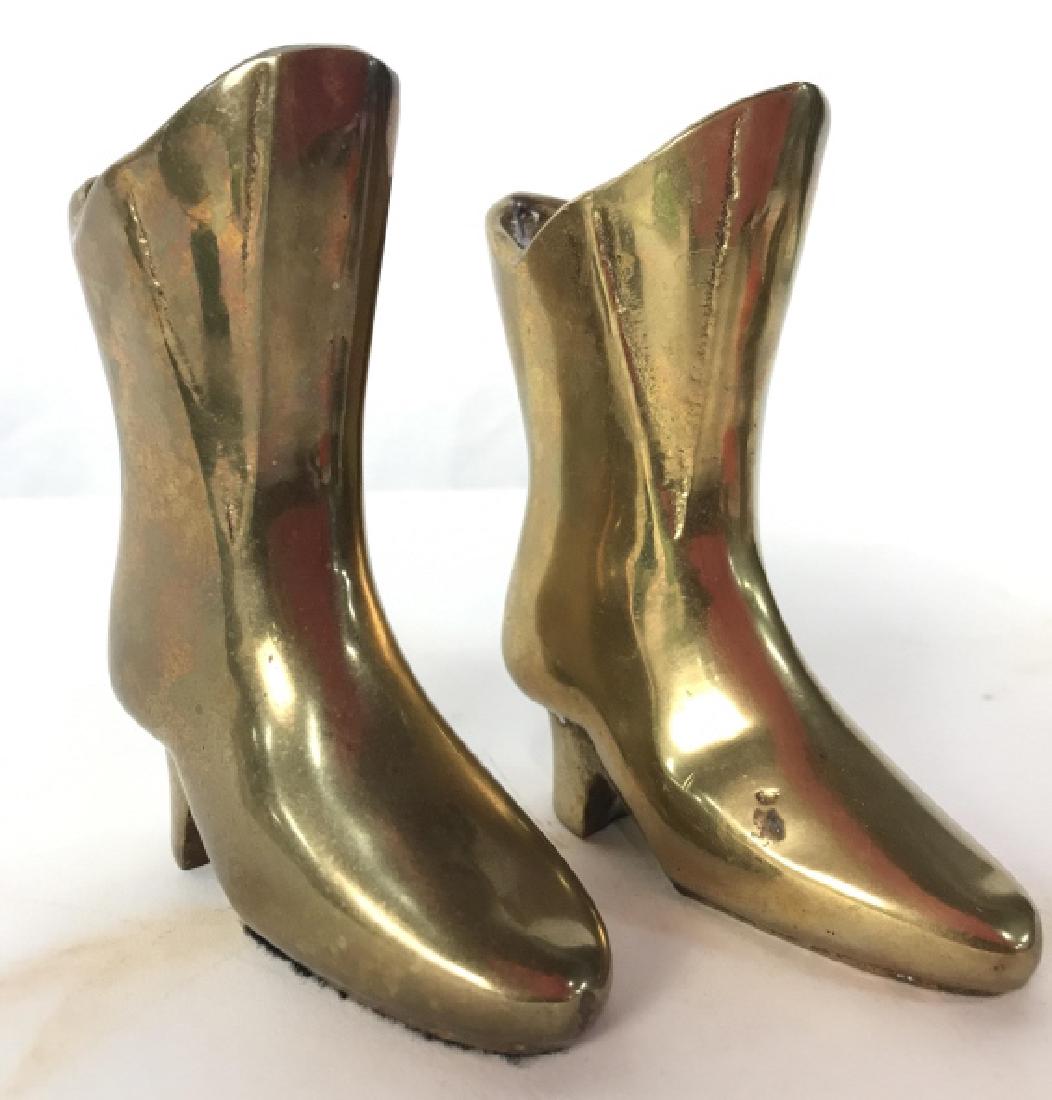 THE BRASS BARN Brass Boot Figurals: Underside has tag which reads THE BRASS BARN. Boot Figurals have heels. Each measures approx 4 inches tall 3.5 inches deep. decorative accessory, home decor, shelf piece Property of a Palm Beach Flori