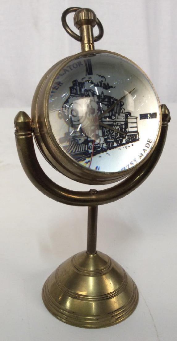Railway Regulator Lever Bubble Glass Desk Clock: Railway Regulator Lever Bubble Glass Desk Clock, 2 3/4 in diameter of sphere, not tested, 6 in tall from base to top of winder, possibly brass, possibly antique, dial has locomotive and Swiss Made, Ra
