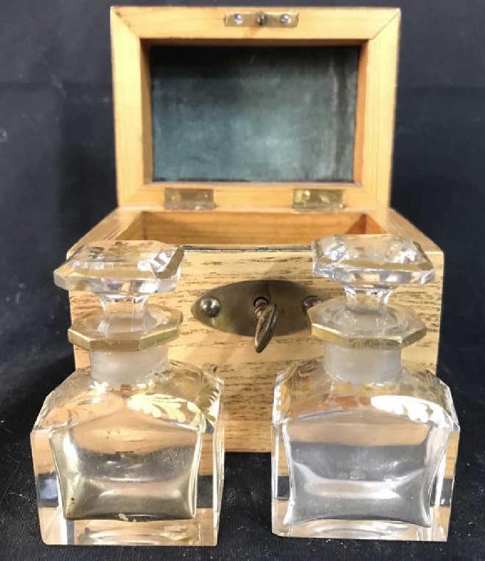 Apothecary Perfume Bottles W Box: Lot includes 2 glass Apothecary Perfume Bottles and 1 wooden box. Box has compartments for apothecary bottles. Bottles have ornate gold toned painted detail. Box is lockable, includes Key. Box measure