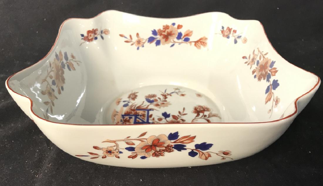 MOTTAHEDEH Floral Detailed Porcelain Bowl: Underside reads MOTTAHEDEH. Contain multi toned floral, leaf and vine detail with tones of blue, red, & coral. Measures approx 9.5 inches tall wide 3.5 inches tall. Tableware porcelain accessory, tabl