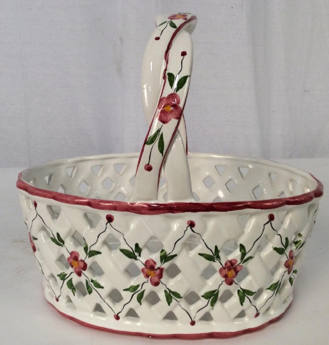 Portuguese Ceramic Basket Bowl: Portuguese Ceramic Basket Bowl, Formed as a woven basket w woven handle, marked underside Hand Painted Portugal, Red 40 LV, LABEL FROM Gumps, Made in Portugal, florals on white ground, 10 in to top of