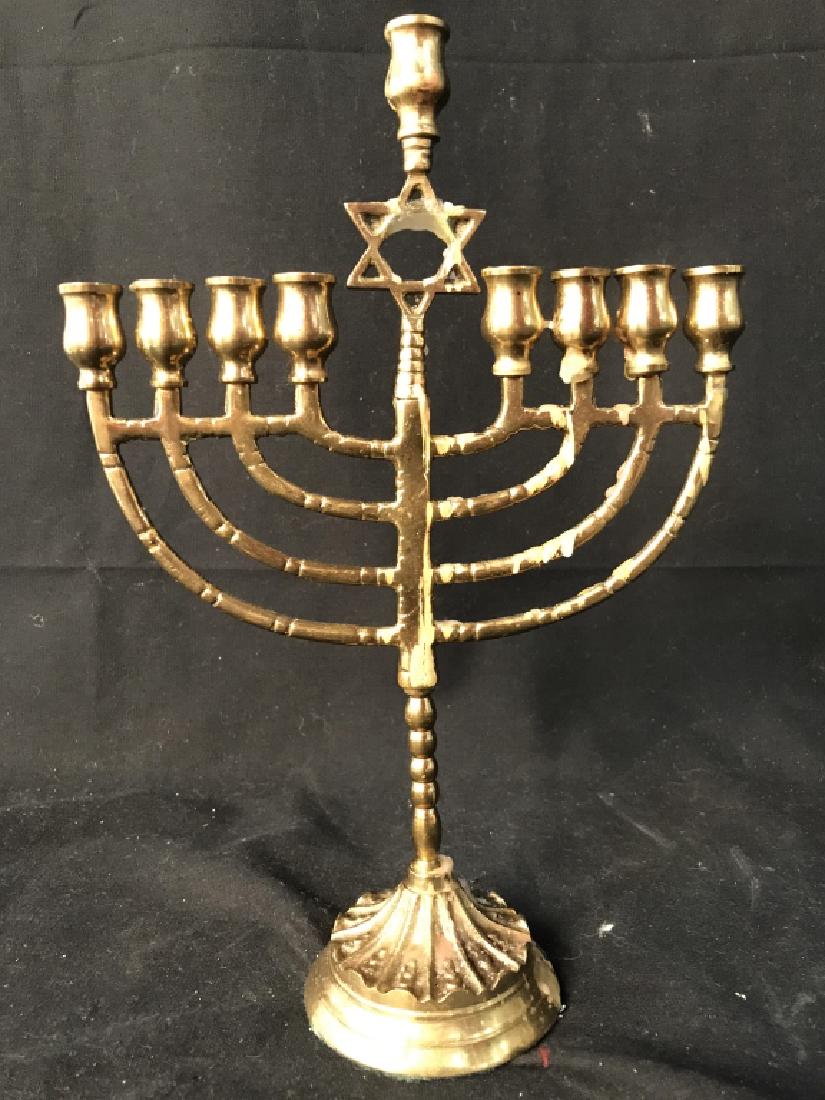 Gold Toned Brass Judaica Menorah: Menorah is brass and gold toned. Center has star or David. Measures approx 10.5 inches tall 7 inches long. Judaica, Hebraica, Brass Menorah, Judaica Menorah. Piece has wax from previous use. 6