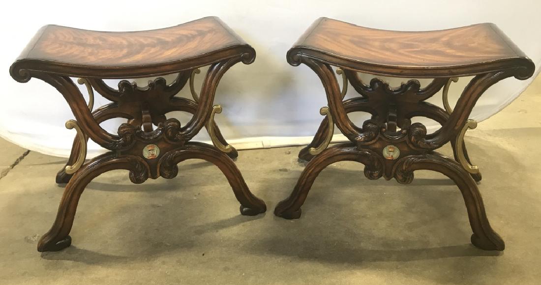 Pair Vintage Carved Possibly Maple Benches: Pair Vintage Carved Possibly Maple Benches With scroll and leaf design X base with concave seats, Gold Toned Painted highlights, and bird and crown painted image, measures approximately 20 inches tall