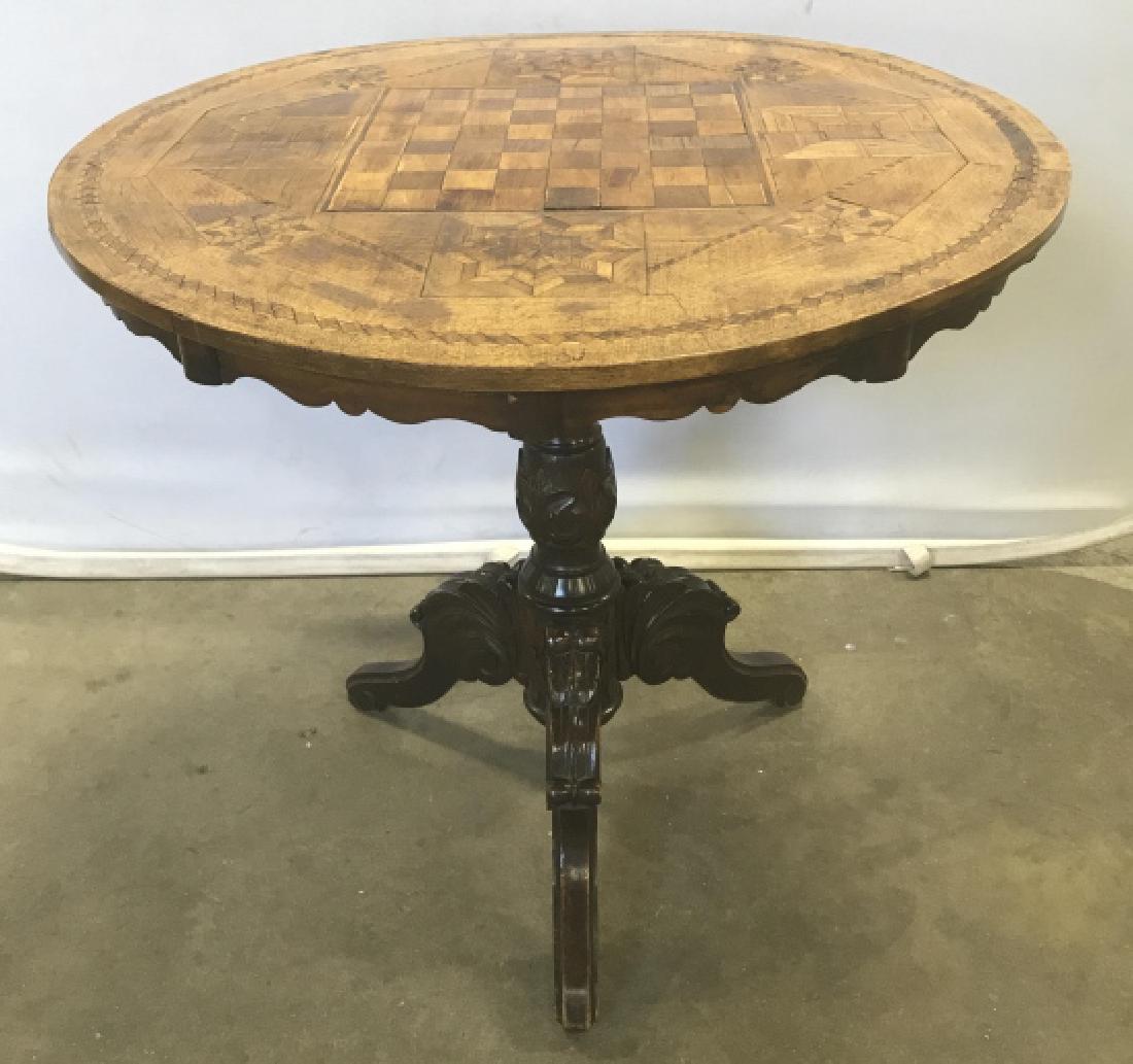 Antique Marquetry Chess Table W Carved Base: Antique Marquetry Chess Table With Carved Tripod Pedestal Base. Table has intricate marquetry work on circular top, w center chess/checkers board surrounded by stars and diamond shaped inlay design, c