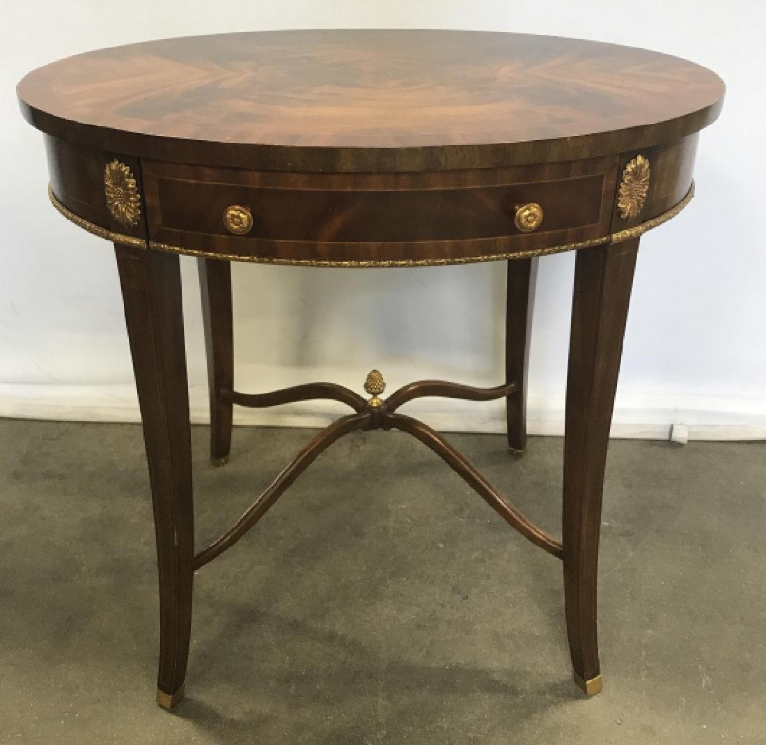 MAITLAND-SMITH Table With Inlay And Ormolu: Vintage Maitland-Smith Oval Shaped Wooden Table With Inlay And Ormolu Floral, pineapple, and garland mounts, measures approximately 28 inches long x 20 inches wide x 26.5 inches tall, very good condit