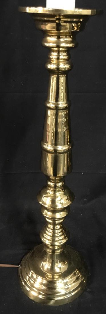 Tall Brass Tone Candlestick Table Lamp: Tall, possibly coated, brass tone candlestick table lamp. Lamp has not been tested. Approx 37 inches in height including finial, by 6 inches in diameter at base. Indoor lighting / interior decor / tal