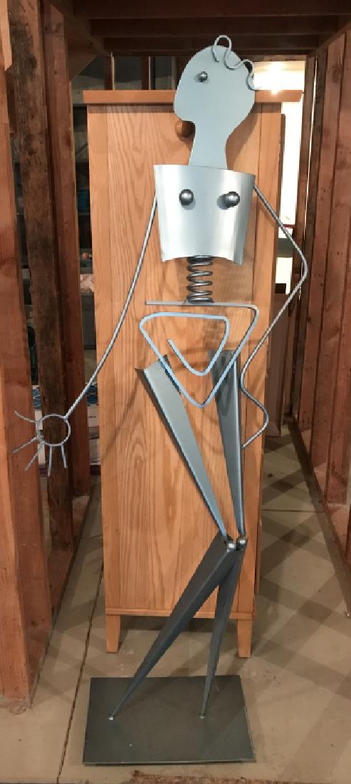 REISS Life Size Abstract Female Metal Sculpture: REISS C1991 Life Size Metal Abstract Female Sculpture. A life size standing abstract sculpture of a female nude constructed of silver blue toned metal welded together. Marked on underside REISS 1991.