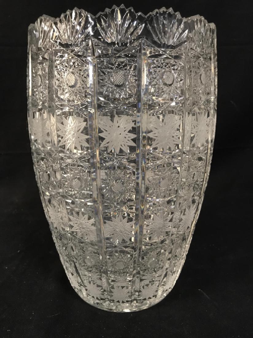 Statement Hobstar Cut Crystal Glass Vase: Oversized statement hobstar cut Crystal glass vase, with some frosted glass details. Vase / Vessel has a repeating hobstar motif. Approx 12 inches in height by 7.5 inches in diameter at opening. Hobst
