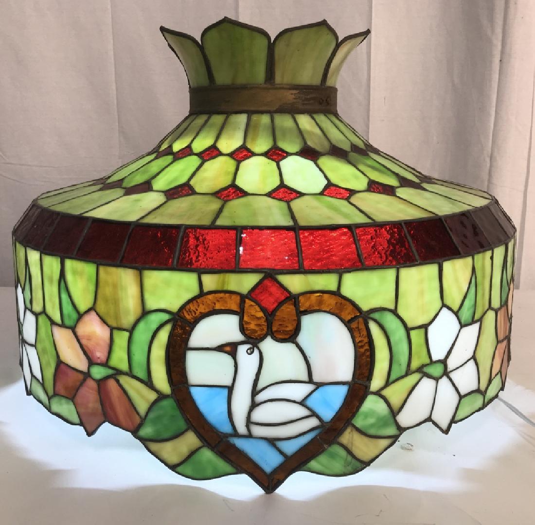 Tiffany Style Stained Glass Pendant Light Shade: Substantial Tiffany Style Stained Glass Pendant Light Shade, bird motif with ruby red accents over green slag glass base, a few minor cracks around drop and damage to one slag glass insert on top, mea