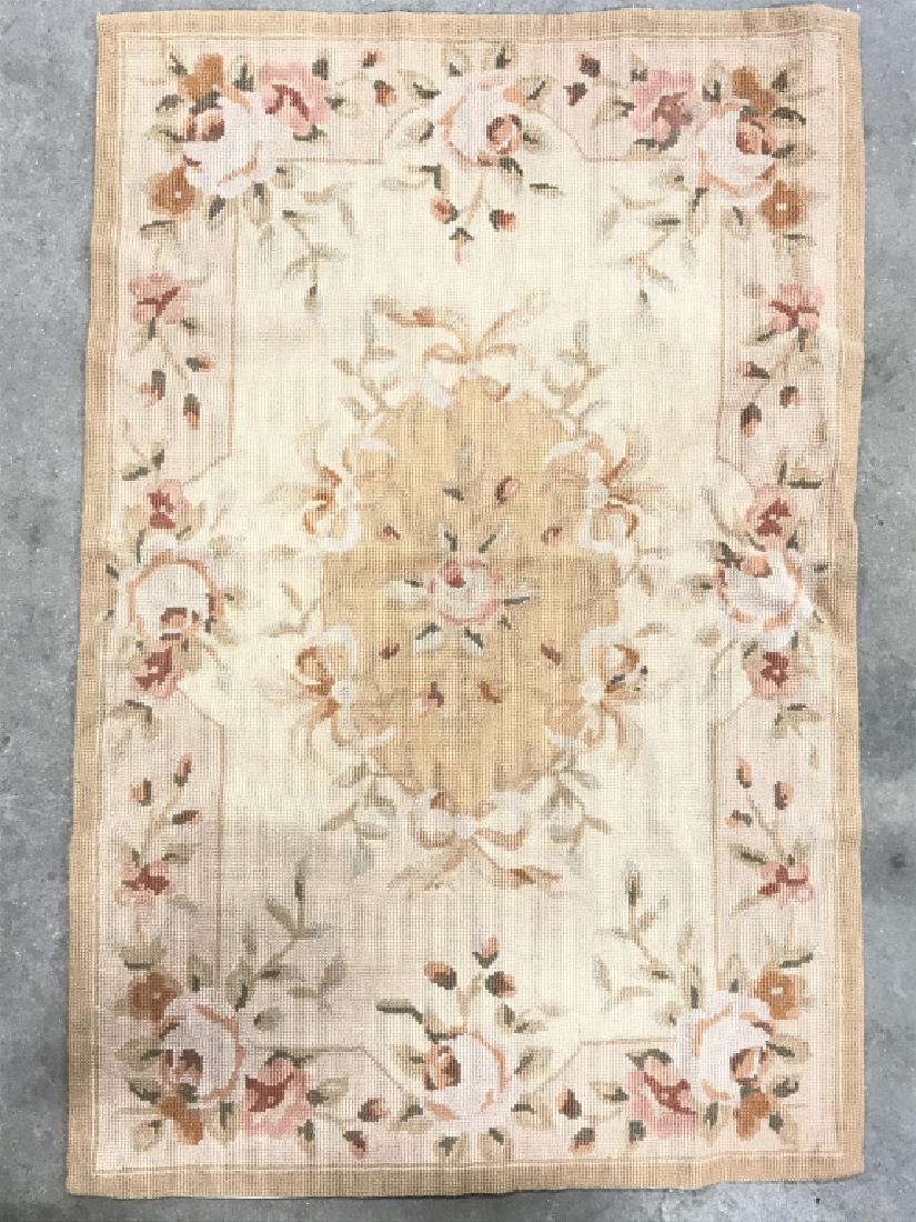 Handmade French Needlepoint Aubusson Rug: Rug is French and handmade. Contains multi toned floral leaf and vine detail including tones of pink, red, olive, beige, and slate. Measures approx 35inches long 24 inches wide. Handmade French Rug, H