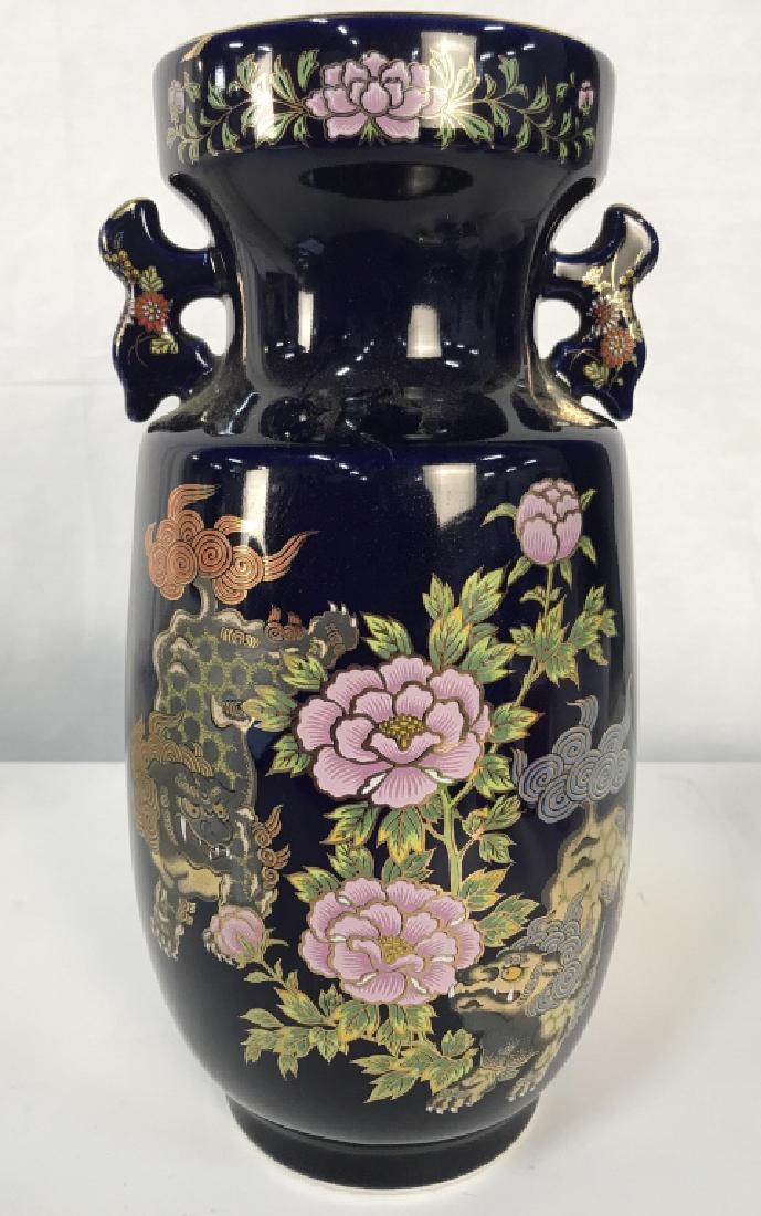 KUTANI Intricate Oriental Porcelain Vase: Piece reads KUTANI on underside. Contains intricate detail depicting foo dogs, floral, vine, and leaf detail. Measures approx 12.5 inches tall 6 inches wide. Asian arts and crafts, Asian decorative ac