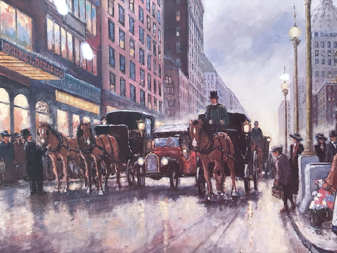 ROBERT LEBRON Framed Print Of City Street: Print depicts a city street with multiple figures, horses and buggy’s and vehicles. Piece is professionally framed and matted with gold toned frame. Lower right corner reads ROBERT LEBRON. Measures 