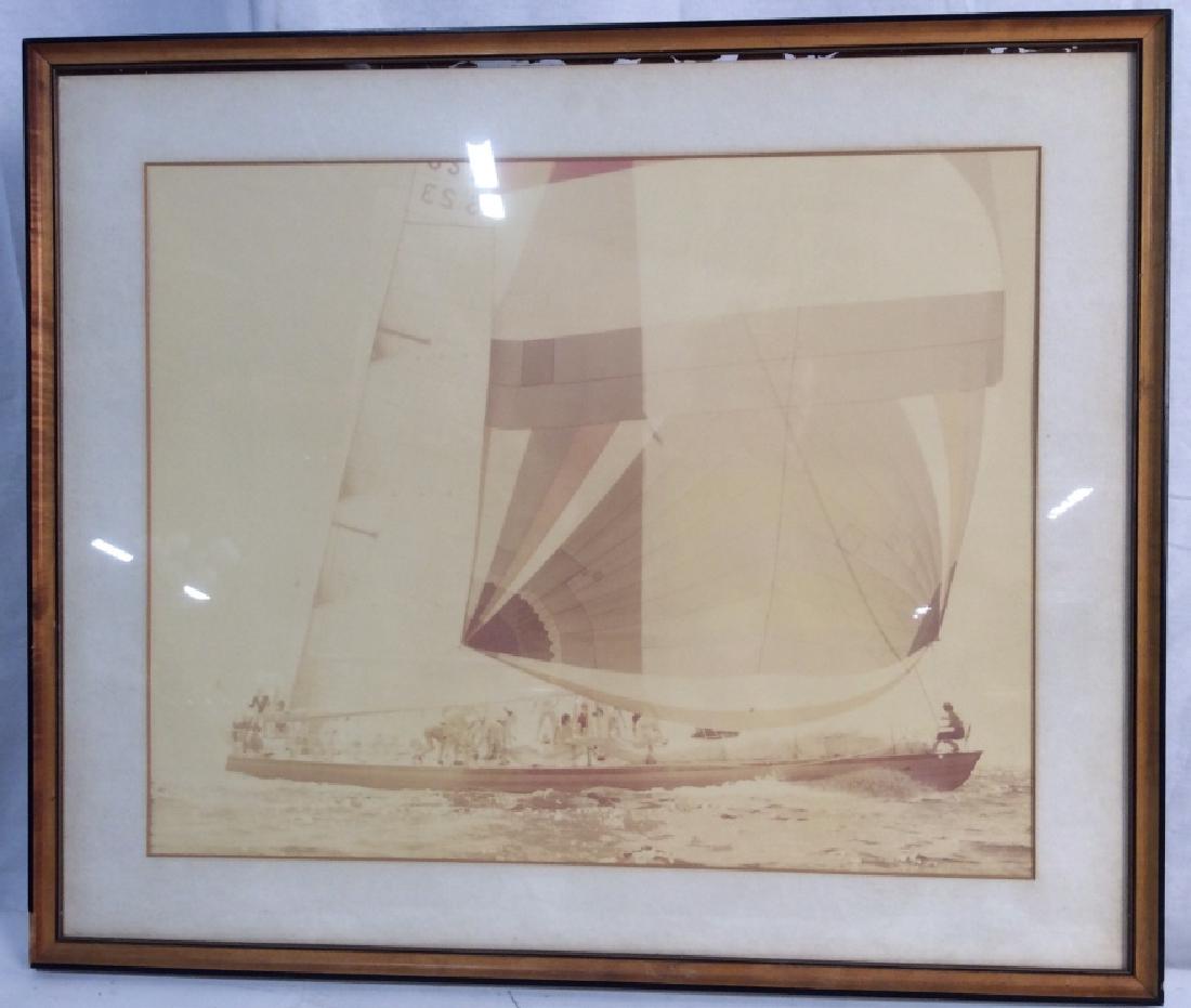 Vintage Framed Photograph Of America’s Cup: Sailboat Framed Photograph Of America’s Cup Sailboat, 21 in x 25in, sun faded, frame chipped, black and wood frame, under glass and matted, not examined out of frame, America’s Cup Memorabilia, Ph