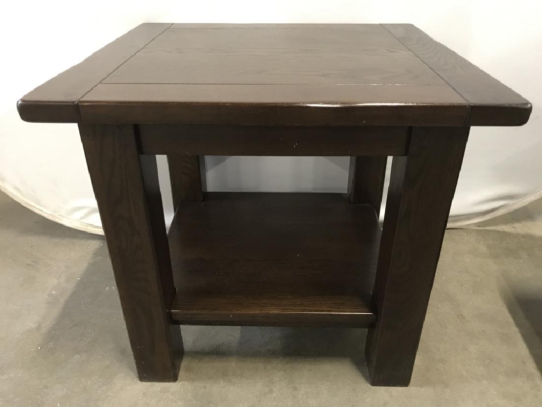 Transitional Style Brown Toned Wood Side Table: Side table is brown toned & wooden. Contains 4 legs. Contains some minor wear. Measures approx 24 inches tall 26 inches square. End table, side table, home accessory, home furnishings 6