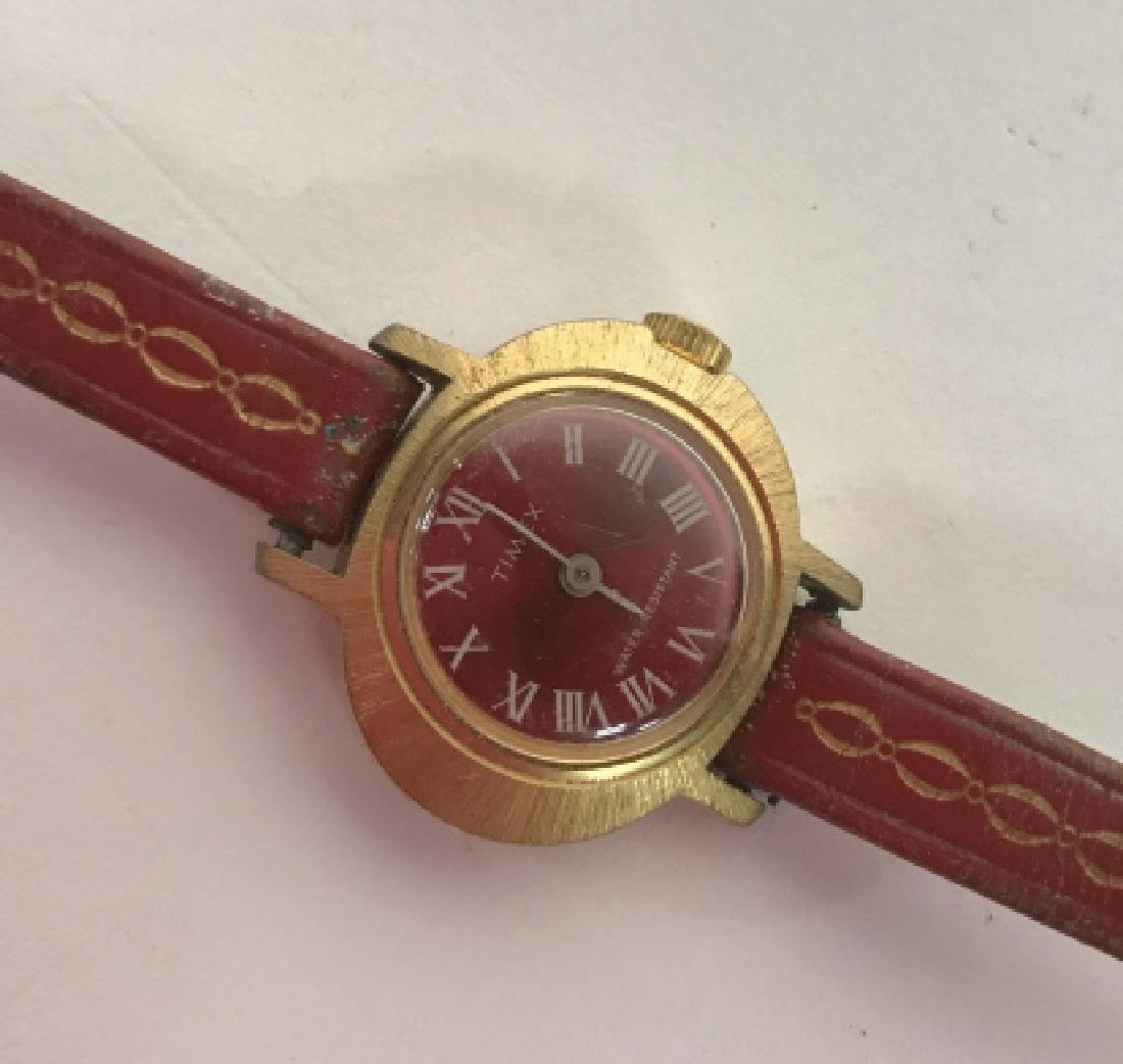 Vintage Ladies Wristwatch Timex: Red leather band gold toned face length app 7 inches, Estate jewelry