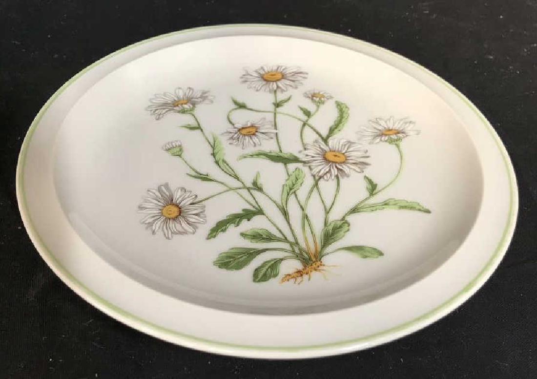 Royal Domino Wild Daisies Porcelain Plate: Royal Dominos Collection porcelain decorative plate with wild daisies motif. Marked on underside with Royal Dominos Collection Japan. Approx 7.5 inches in diameter. Porcelain dishware / tableware / ta