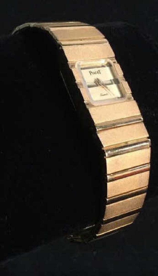 Gold Tone PIAGET Polo Wristwatch: Women’s Men’s Gold Tone PIAGET polo wristwatch. Jewelry bracelet Wristwatch. Reads ‘Piaget Quartz’ on Clock face. Hong Kong engraved on End clasp. Length of Wristwatch unclasped is Approximate