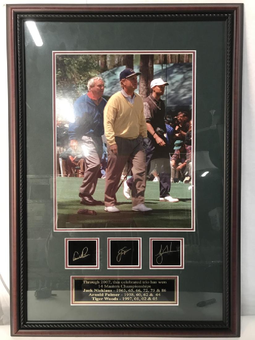 Framed Photo Of Professional Golfers: Photo print depicts Jack Nicklaus Arnold Palmer & Tiger Woods. Piece is professionally framed with dark mahogany toned wooden frame. Framed signatures part of artwork, possibly print signatures, Golf