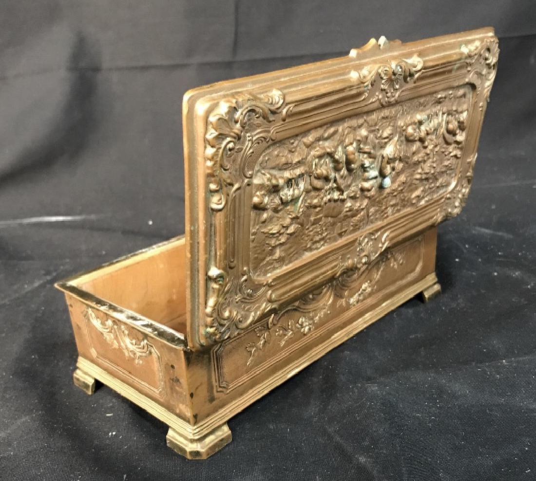 Bronze Finish Keepsake Box: Scene in relief of cherubs farm animals, sheep and village hinged lid, measures app ht2.75 inches top 7.75 by 3.75 inches approx, trinket Box, decorative accessory, tableware