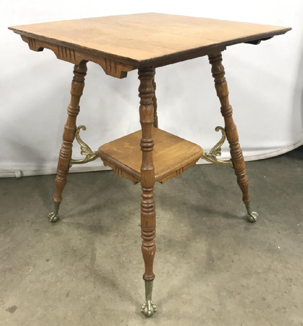 Vintage Oak Toned Ball And Claw Footed Table: Vintage possibly antique Oak Toned Ball And Claw Footed Table with gilt metal accents, crack to table top, surface marks and scratches, measures approximately 24 inches square x 29.5 inches tall. Coun