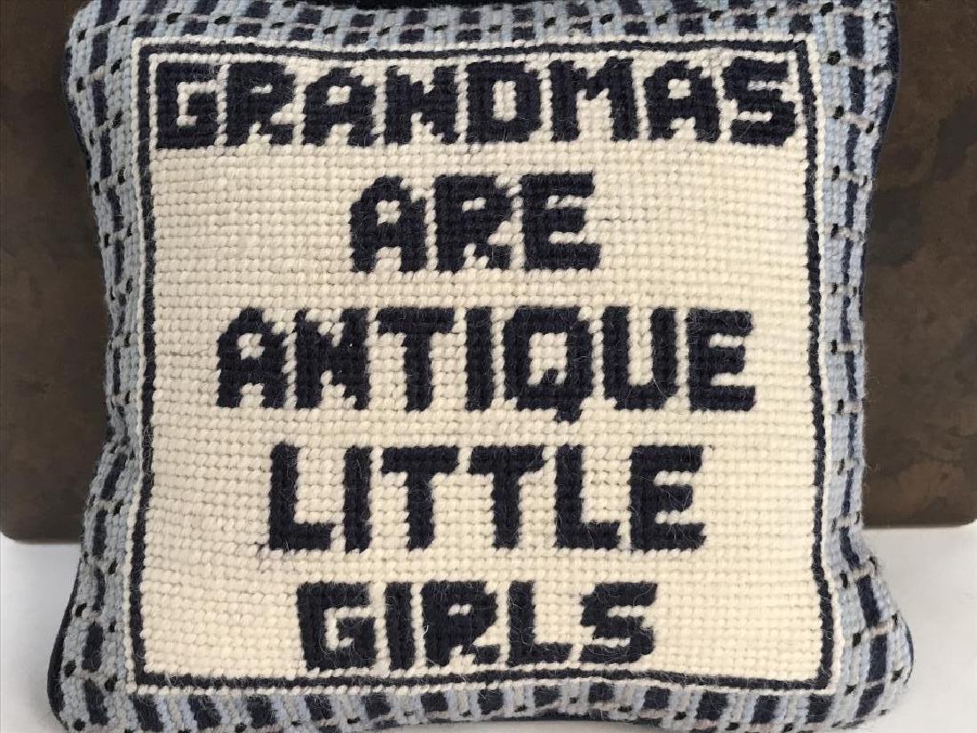 Small-Scale Throw Pillow W Grandma Proverb: Petite Throw pillow with needlepoint cover. Pillow has the saying ‘Grandmas are antique little girls.’ Pillow is blue and white in tone. Approx 7.2 inches in height by 8 inches in width by 3 inche