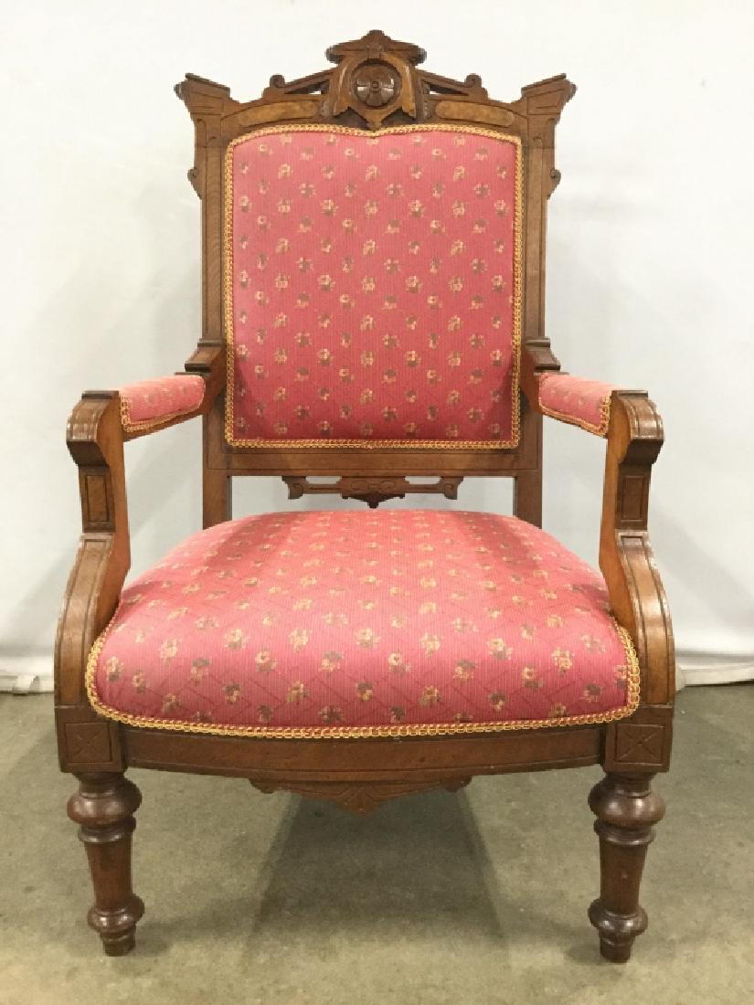 Carved Eastlake Style Armchair: Vintage/Antique Intricately Carved Eastlake Style Armchair, pink and green floral designed upholstered arms, seat, and back, trim welting, and turned front legs, measures approx 40.5 inches tall x 23 