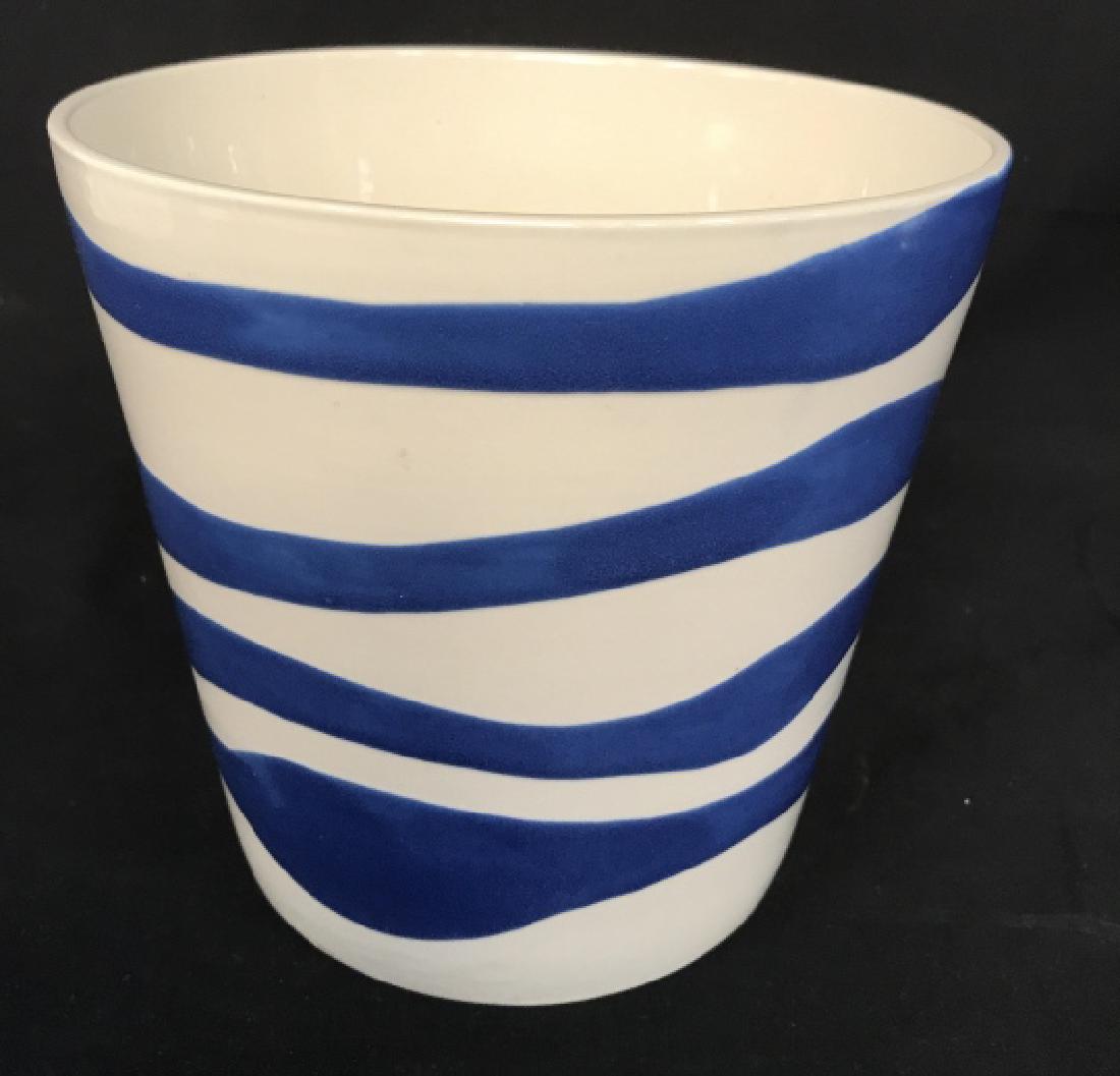 White and Blue Swirl Ceramic Planter: White and blue swirl ceramic planter / pot / cache pot Approximately 7.2 inches in height by 7.5 inches in diameter. Marked on underside for IKEA. Outdoor garden accessory / home decor. Planter vessel