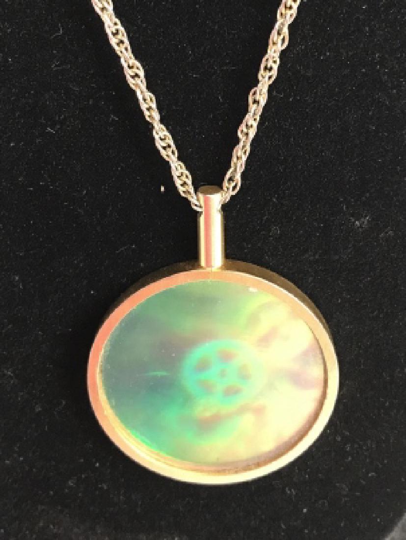 Hologram Gear Images Pendant Necklace: Chain necklace, with disc shaped pendant, pendant has hologram of industrial mechanical gears, film projector wheels, stars, Estate jewelry, vintage jewelry, pendant diameter 1.75 inches, drop of chai