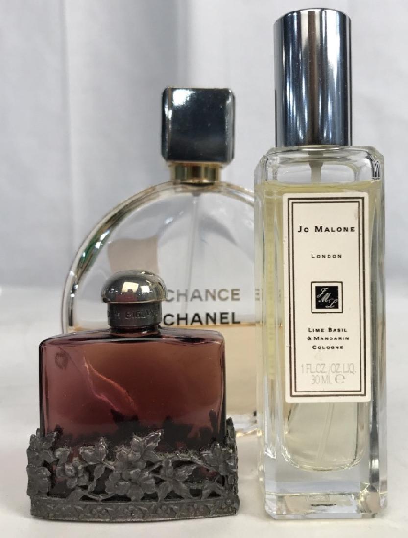 3 Vintage Perfumes in Bottles, CHANEL and: One bottle marked CHANCE CHANEL, partially filled with perfume ht of Bottle app 5 inches, one bottle marked for Jo Malone London, one fl oz, bottle has been opened, one bottle hand made amethyst glass