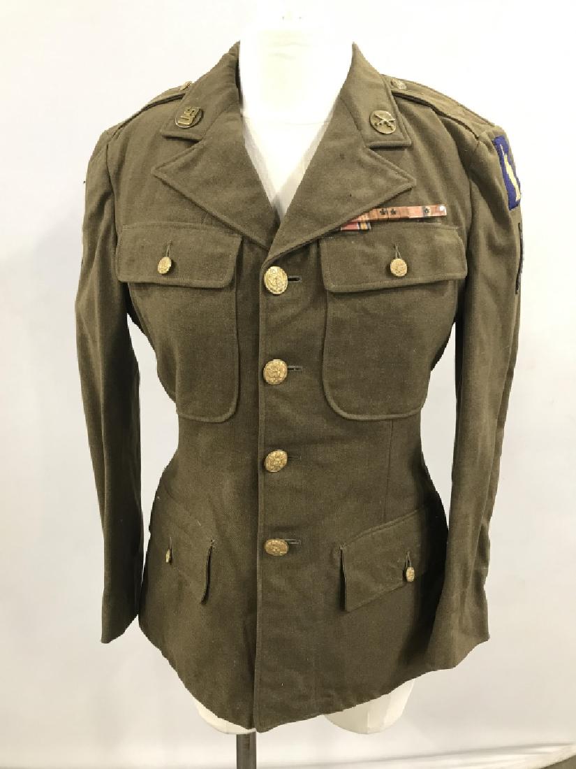 WW2 Military Jacket W Gold Toned Eagle Buttons: WW2 Men’s Green Military Jacket with Gold Toned Metal Eagle Emblem Buttons, Various Military Badges, one with the Statue of Liberty, Service Ribbons, and pins. Size unknown possibly size small, need