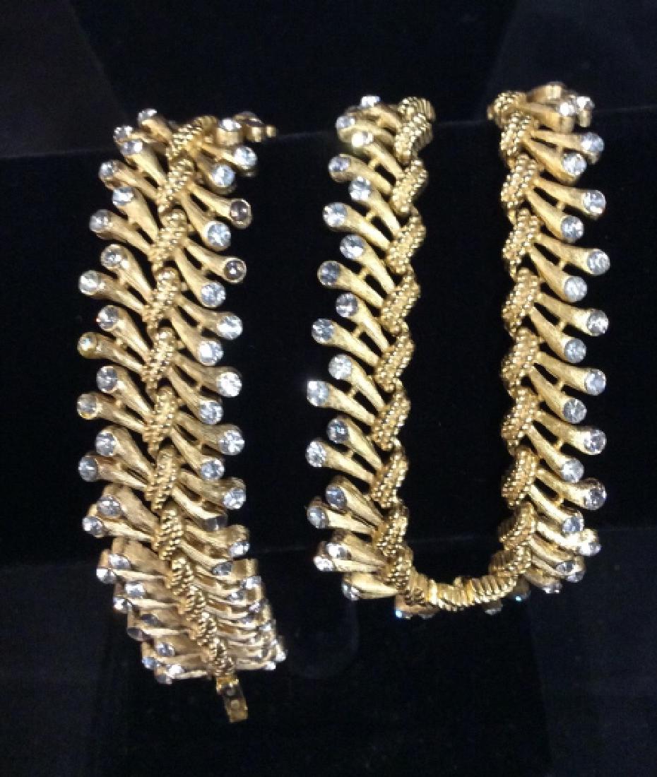 TRIFARI Jewelry Set Necklace And: Brushed gold toned Necklace with inset Rhinestones matching bracelet, richly detailed, length of necklace app 12 inches plus 3 inches extra adjustable chain, bracelet length app 7.5 inches, both marke