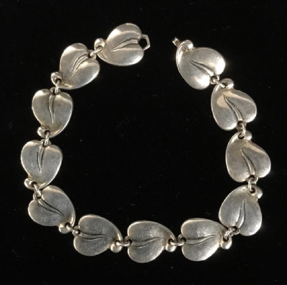 Sterling Silver Denmark Leaf Form Link Bracelet: Vintage Sterling Silver Leaf Form Link Bracelet, marked on underside Sterling Denmark E&M 161, Bracelet weighs approximately 21 g, measures approx 7 7/8 inches long x .50 inches wide. Scandinavian Ste