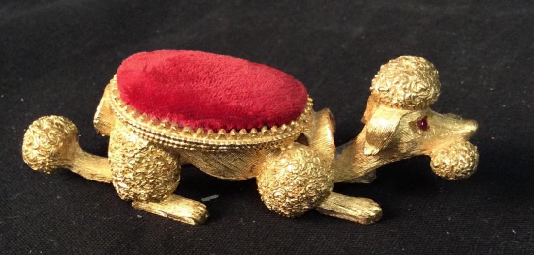 FLORENZA Gilded Metal Bobble Head Poodle: Marked on interior FLORENZA gold toned metal red felt top, bobbing reticulated head and tail, desk top accessory, decorative animal Figural, dog Sculptural, poodle ring holder possibly, red stone eyes