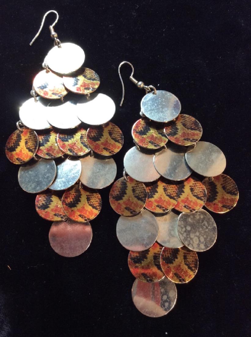 Silver Toned Metal Disk Earrings: Silver Toned Metal Disk Earrings hanging pierced earrings with flat metal discs, silver toned mixed with snakeskin design discs, Measures approx 4 in long. Womens statement earrings, statement jewelry