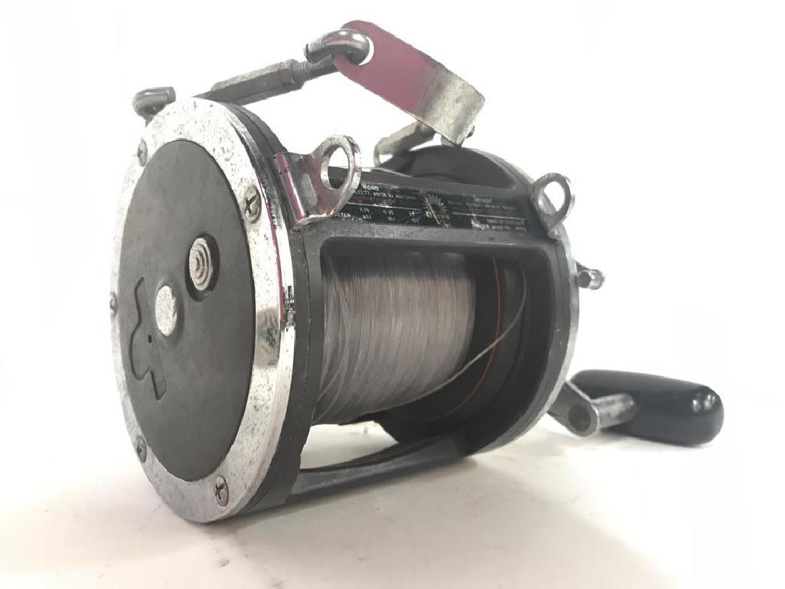 DAIWA Fishing Reel & Line: Tag on reel reads DAIWA SEIKO INC. Lot includes fish reel and fishing line. Piece is vintage. Contains wear due to use. Handle on reel turns smoothly. Measures approx 8 inches long 7 inches deep. Fish
