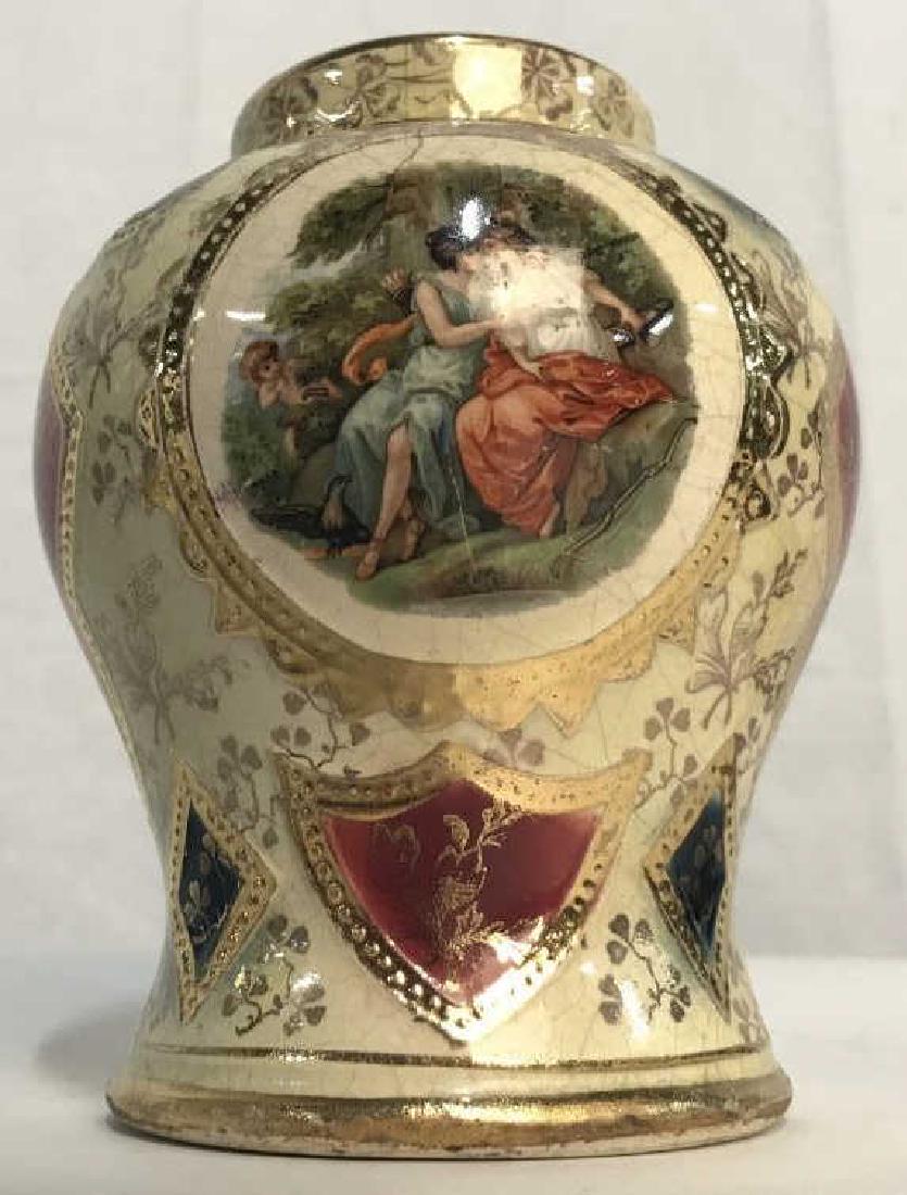 Royal Vienna Multicolor Ginger Jar: Royal Vienna multicolor ginger jar. Jar has motif of women in a garden with a Cupid onlooker. Marked for Royal Vienna on underside. Jar is missing its lid. Measures approx 4.5 inches in height by 3.5 