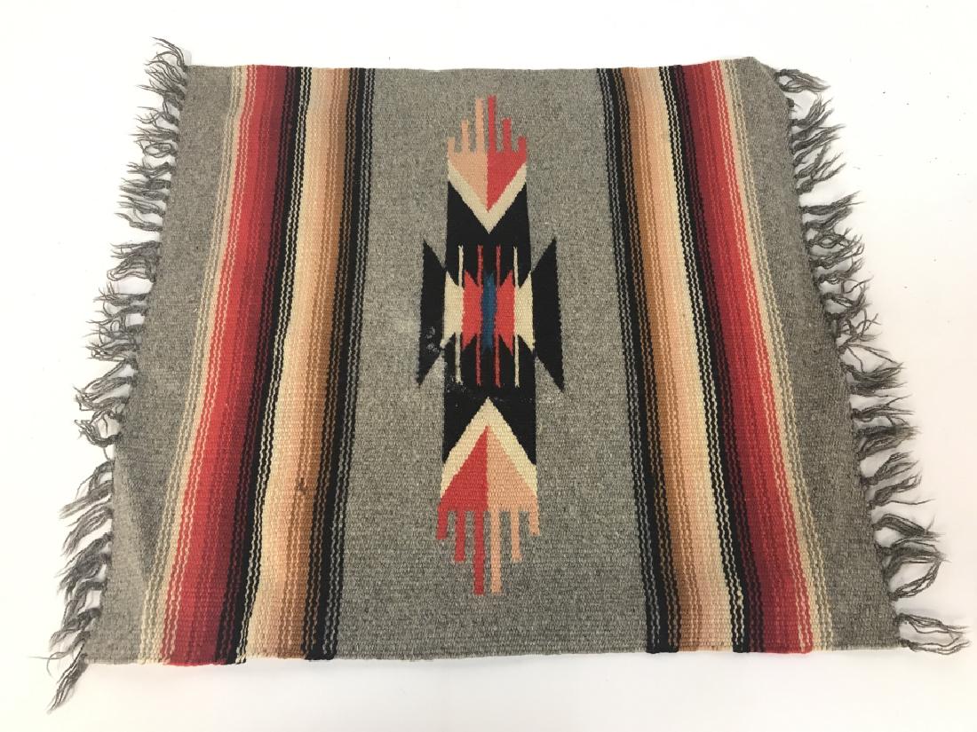 Navajo Multi Toned Textile Artwork: Appears to be hand woven. Contains tones of black, beige, grey, and red. Measures approx 22 inches long 18 inches wide. Vintage possibly antique, wall hanging, Native American arts and crafts, south w