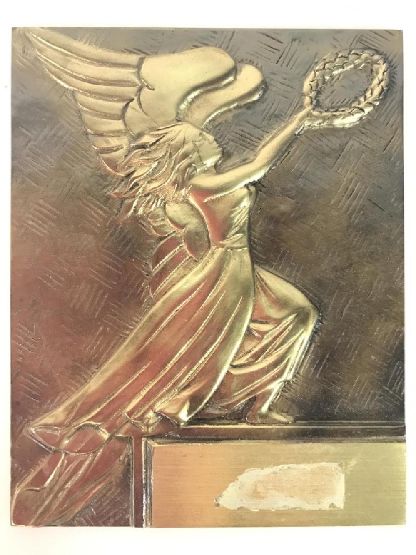 Vintage Gold Toned Metal Angel Plaque: Piece is metal and gold toned. Contains a beveled depiction of an Angel Figure. Piece has significant weight for size. Measures approx 8 inches tall 6 inches wide. Home decor, religious classical artw