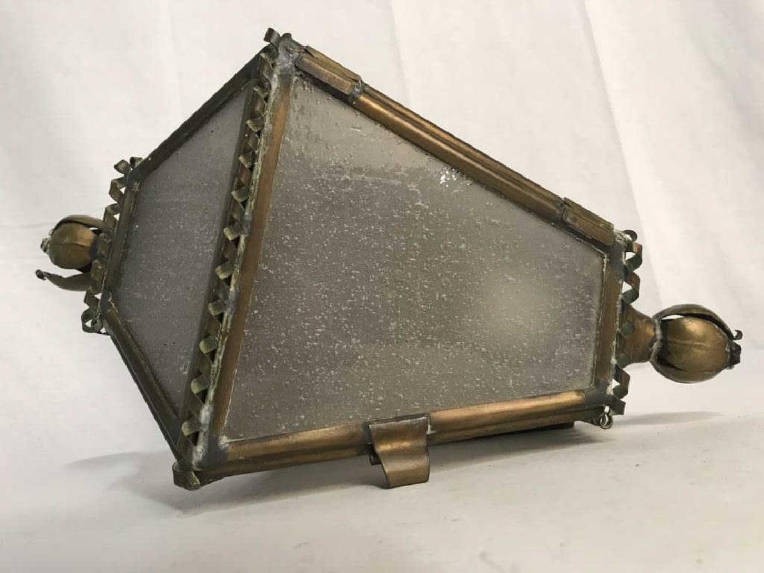 Vintage Brass and Glass Wall Sconce: Vintage brass and glass wall sconce. Light has not been tested. Brass has moderate discoloration consistent with age, will need polishing. Some warping of Metal. Measures approx 12 inches in height by