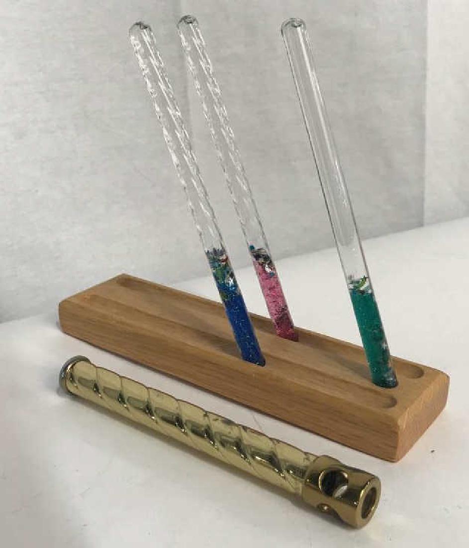 Sheryl Koch Design Kaleidoscope: Kaleidoscope with 3 colorful glitter filled inserts for additional kaleidoscopic views. Pieces sit on a wood stand. Underside of stand has Sheryl Koch label, copyright 1996. Kaleidoscope measures appr