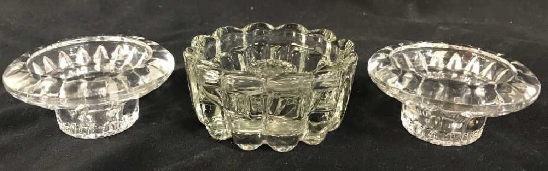 Lot 3 Cut Glass Tabletop Accessories: Lot includes 2 candlestick holders and 1 cut glass dish. Largest piece measures approx 4 inches wide 1.5 inches tall. Tableware, glassware, table top accessory, home accessory 6