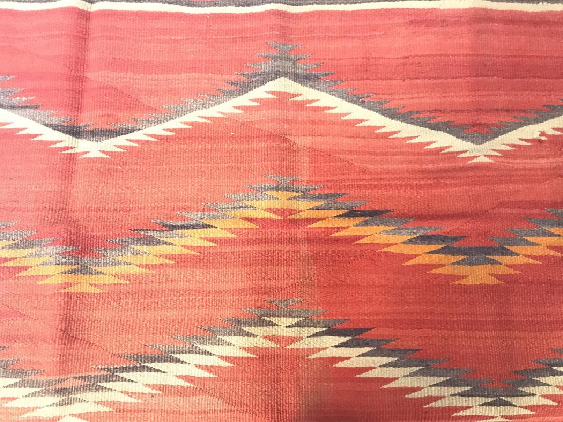 Antique Eye Dazzler Half Chief Blanket: Piece is handmade. Appears to be wool. Contains tones of red, beige, orange and brown. Measures approx 52 inches long 35 inches deep. Wall hanging, tapestry, home accessory, native American arts and c