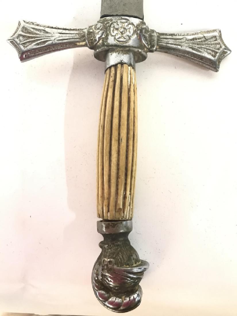 Antique Presentation Civil War Period Sword C 1870: Sword handle appears to possibly be made from carved bone. Lower end of handle has Knight helmet detail. Piece is worn in antique condition. Includes silver toned sheath. Measures approx 36 inches lon
