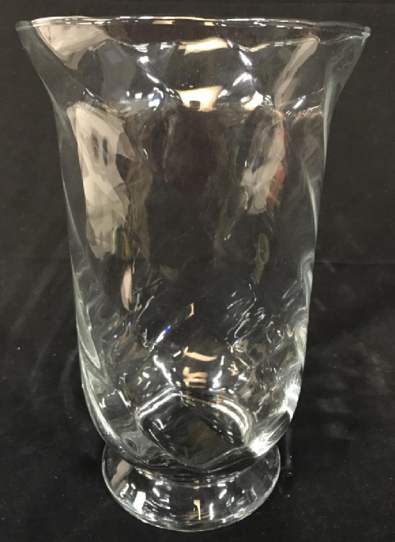 Low Footed Glass Vase: Vase is glass and footed. Top inch of vase flares out. Measures approx 12 inches tall 7 inches wide. Tabletop accessory, tableware, Home Decor, Home accessory. vase, vessel 6