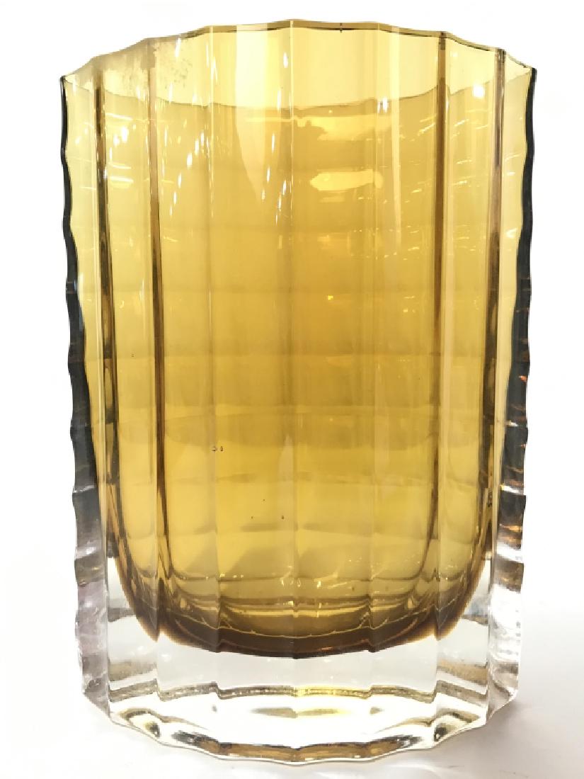 Amber Toned Glass Vase: Vase is Amber Toned And Glass. Piece has eyelid shape. Bottom of piece is thick. Measures approx 8 inches tall 6 inches wide 3 inches deep. Rim has minor imperfection. tableware, tabletop accessory, d