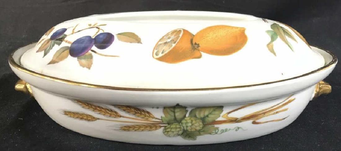 Vintage ROYAL WORCESTER Porcelain Tureen: Underside reads ROYAL WORCESTER MADE IN ENGLAND. Tureen is oval shaped. Contains painted depictions of fruit and vegetables. Contains 2 gold toned handles. Measures approx 11 inches long 7 inches deep